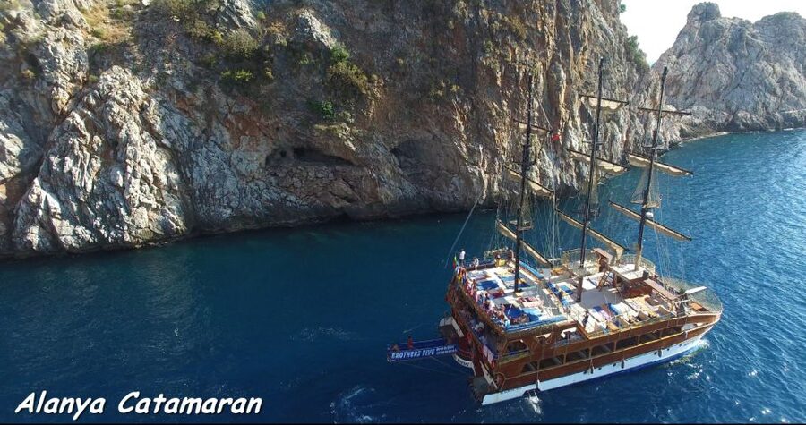 Alanya: Catamaran Boat Trip with Sunbathing and Swimming - The castle caves, seen from offshore
