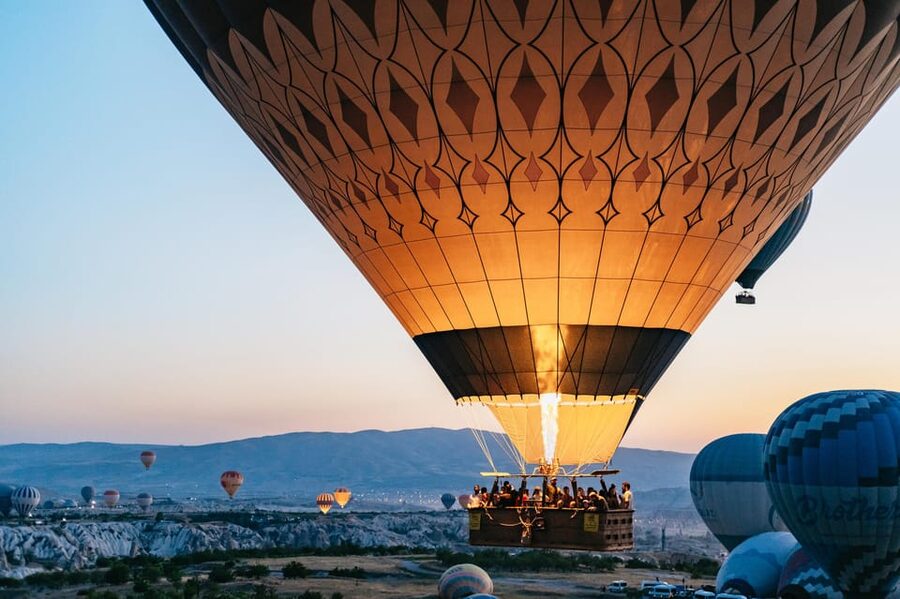 Balloons rising over the fairy chimneys at G&ouml;reme, Cappadocia