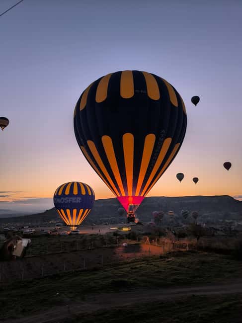 Cappadocia: Goreme Hot Air Balloon Flight Experience - Sunrise, photographs, and the view below