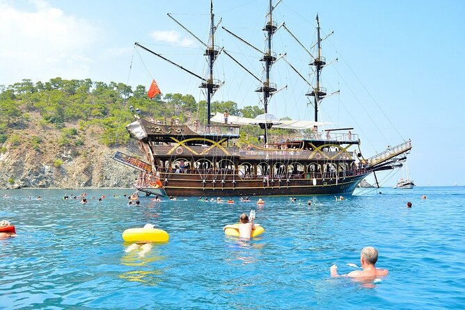 GONSTER : Luxury Pirate Boat Trip Lunch & Soft Drinks & Transfer - Phaselis Bay, trees, sand, and clear water