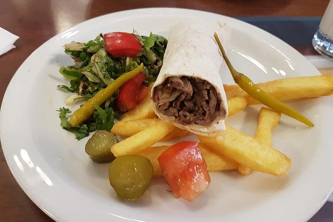 Istanbul Kadikoy Food Tour with 12+ Local Delicacies Tastings - Market flavors and lahmacun on Güneşlibahçe Sokağı