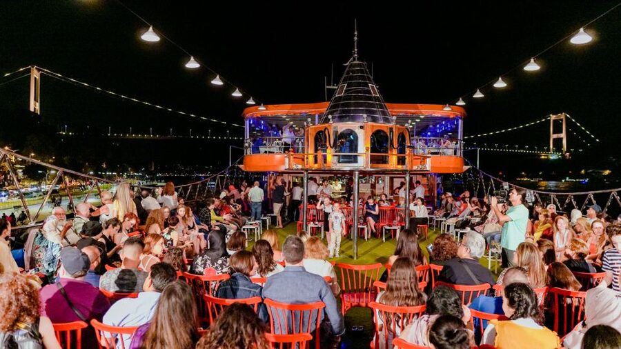 Istanbul: Turkish Night on the Bosphorus Dinner Cruise - Boarding with Turkish Delight and a prepared table